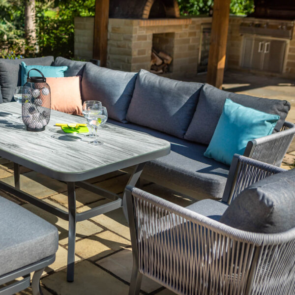 angled_shot_of_grey_metallic_garden_furniture_with_ceramic_tabletop_in_sunshine