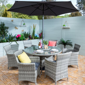 6_Seat_Hartman_Westbury_Set_On_Patio_With_Planters_In_Background
