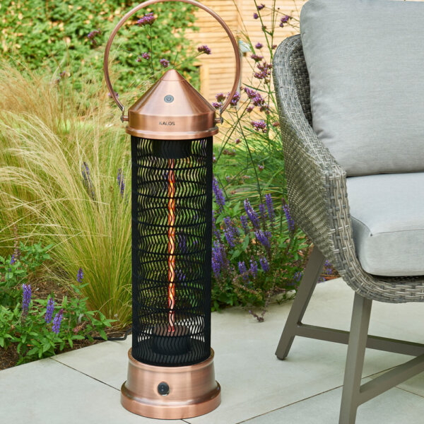 Kettler Copper Patio Lantern Large 2000W on garden patio with plants and outdoor chair