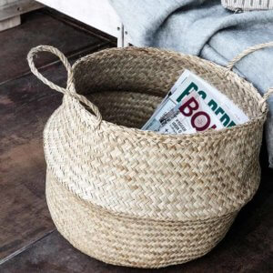 Dalby round woven storage basket with magazines inside