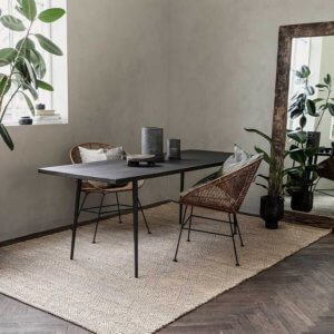 Ingra RectiIngra woven jute rug with table and chairs on top next to plants
