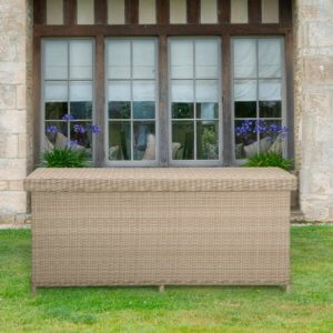 closed Bramblecrest cushion box in sandstone on a lawn in front of a large window