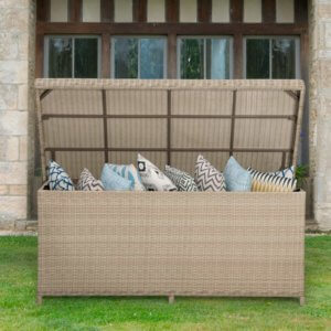 Bramblecrest cushion box in sandstone filled with cushions and placed on a lawn