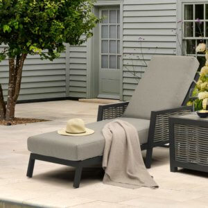 Bramblecrest Portofino Reclining Lounger with blanket and sun hat placed on top