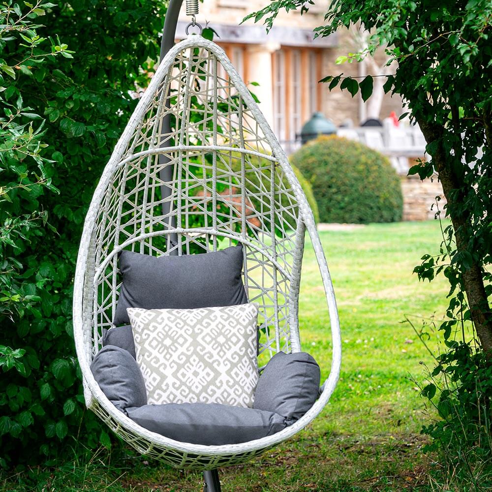 Bramblecrest Tetbury Teardrop Single Cocoon Chair under a garden arch