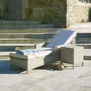Bramblecrest Chedworth Reclining Lounger with Ceramic Top Coffee Table - Sandstone- reclined on stone patio infront of steps