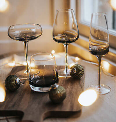 Melbury glasses on a table with fairy lights and baubles