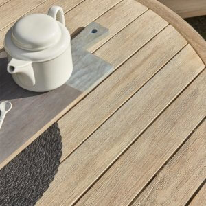 Kettler Cora Round Dining Table Set placed in a courtyard with tea laid on the table
