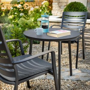 Hartman Aurora bistro set with coffee and a book placed on top