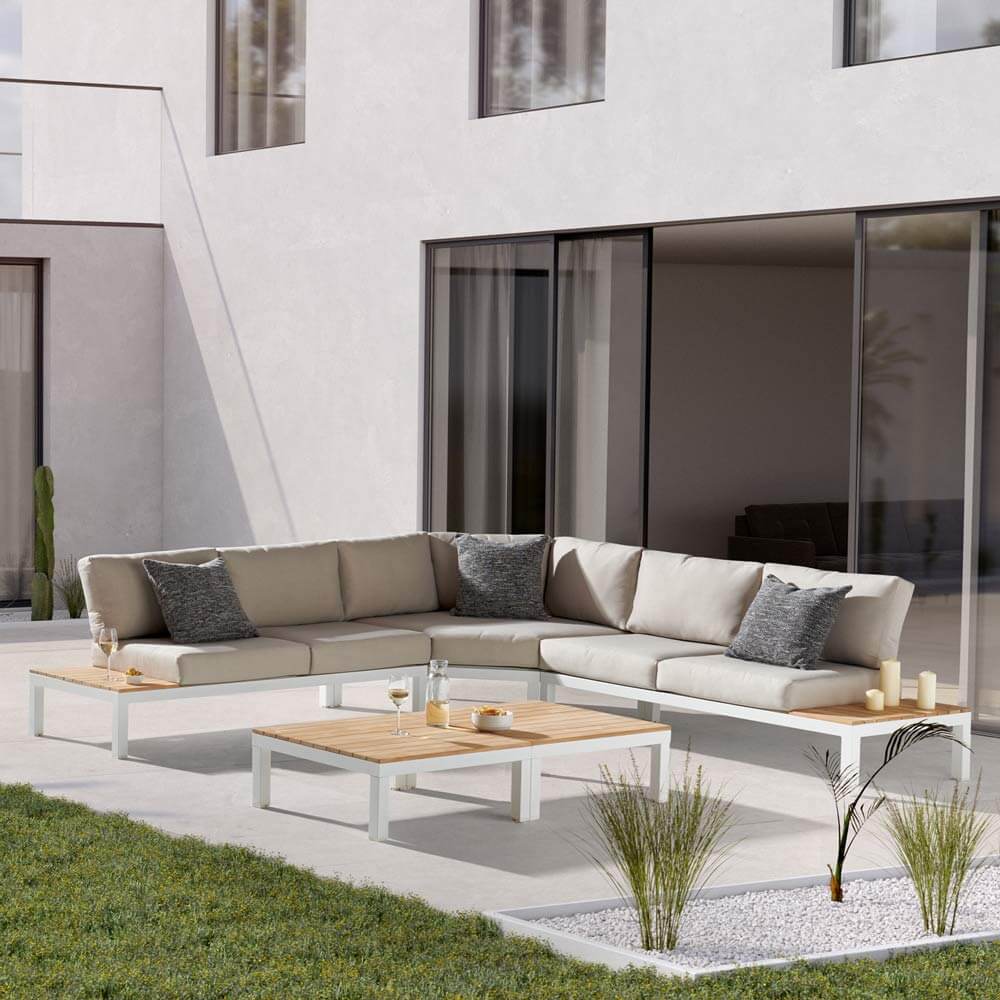Kettler Elba Low Lounge Large White Corner Sofa Set on patio paving in the Sun
