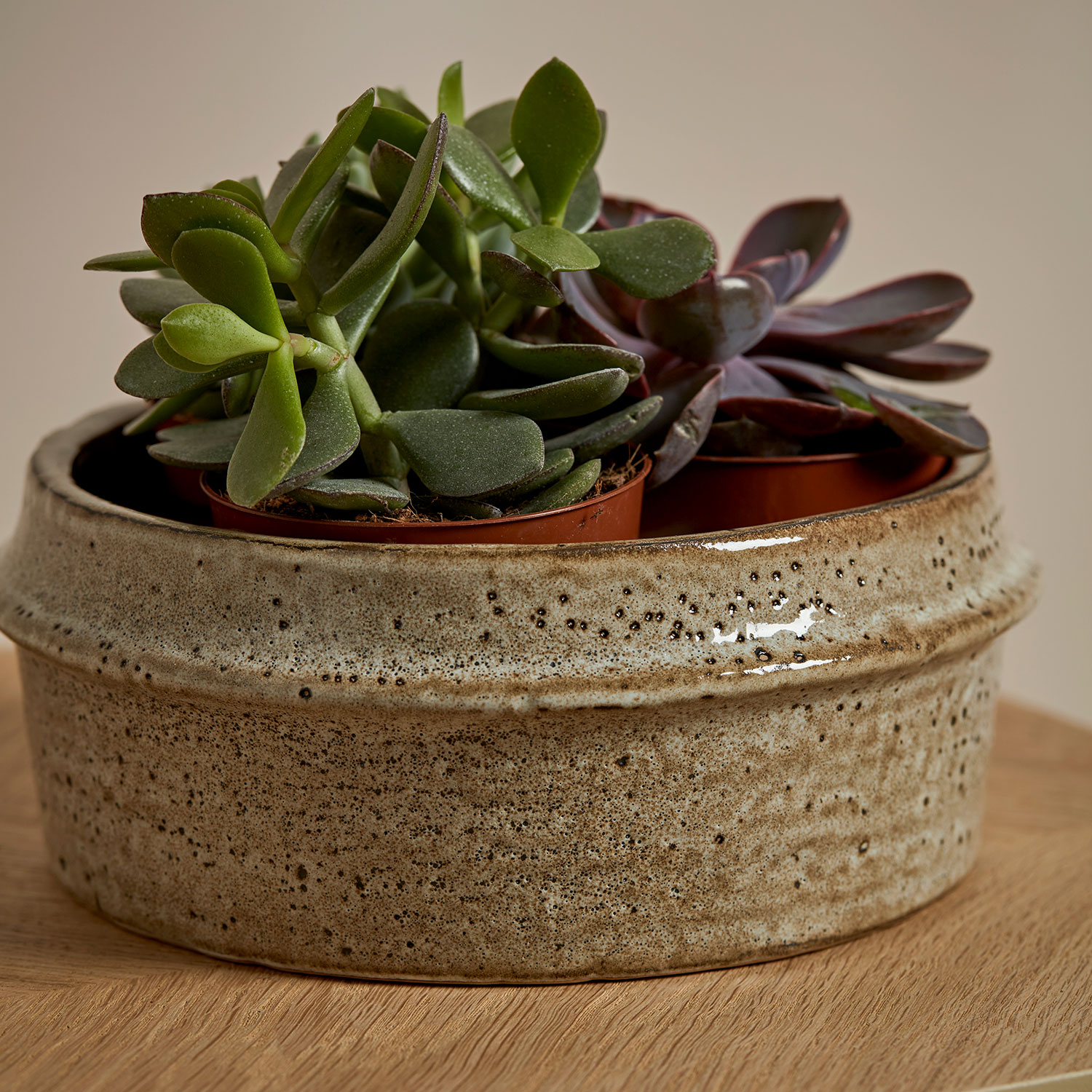 Marton Plant Pot Small Stone on a wooden surface