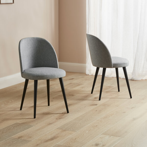 grey tone fabric cup back dining chairs with dark wood hardwood legs