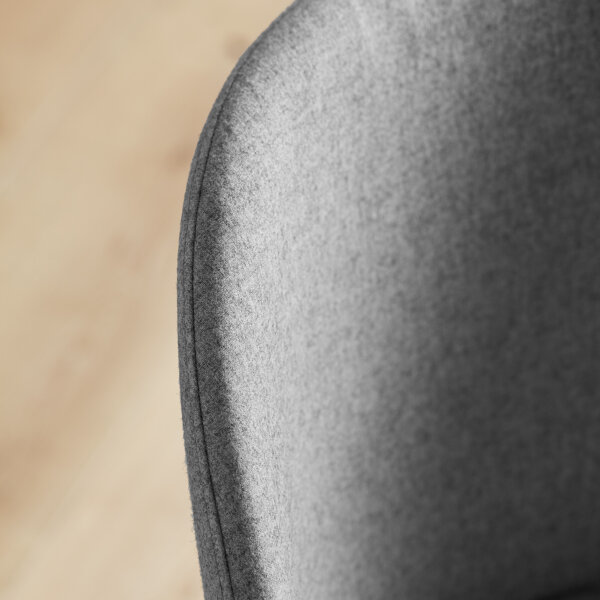 grey tone fabric cup back dining chairs with dark wood hardwood legs