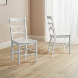 White & Grey chevron dining chairs places on a wooden floor